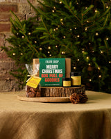 Christmas Honey Gift Box places neatly on a log